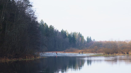 Fishermen are fishing on an ice floe. Winter fishing.