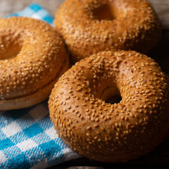 Sesame bagels on wooden background