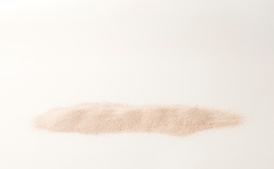Fototapeta na wymiar A lot of dry beach sand on white background