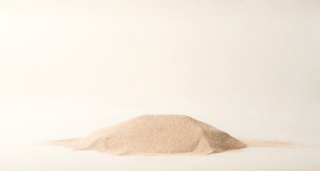 A lot of dry beach sand on white background