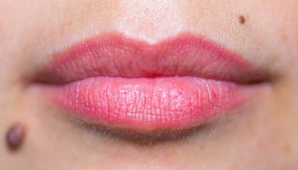 Fototapeta premium beautiful, female, red lips and mole close-up