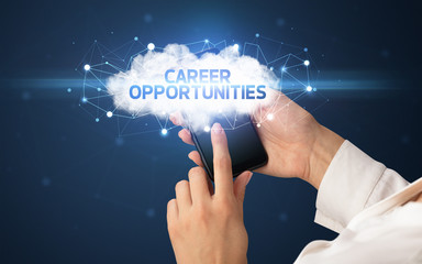 Female hand touching smartphone with CAREER OPPORTUNITIES inscription, cloud business concept
