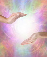 Together our healing energies combine to create a powerful influence - male hand opposite female...