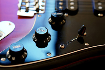 Electric guitar, close up volume controls
