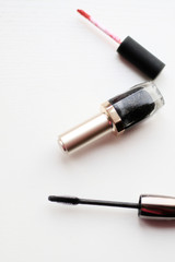 Obraz premium mascara, nail polish and lipstick brush on white background