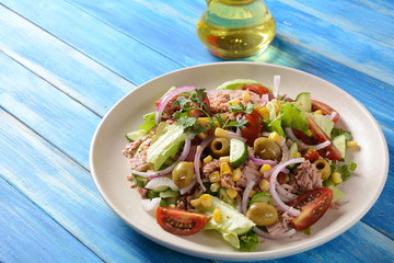 Tuna salad with lettuce, eggs and tomatoes, cucumber, corn and red onion. Healthy Mediterranean food concept