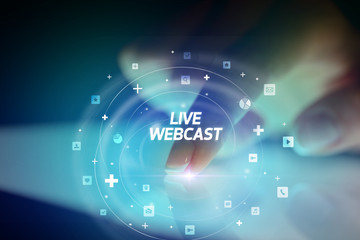 Finger touching tablet with social media icons and LIVE WEBCAST