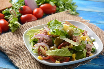 Tuna salad with lettuce, eggs and tomatoes, cucumber, corn and red onion. Healthy Mediterranean food concept