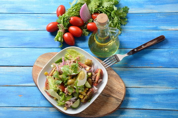 Tuna salad with lettuce, eggs and tomatoes, cucumber, corn and red onion. Healthy Mediterranean food concept