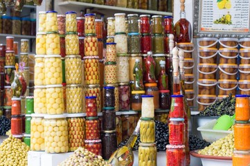 Olives and pickles in jars on display in Marrakesh souk