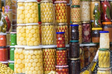 Olives and pickles in jars on display in Marrakesh souk