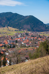 Fototapeta na wymiar spa town Schliersee, view from Schliersberg mountain, at early springtime. vertical shot