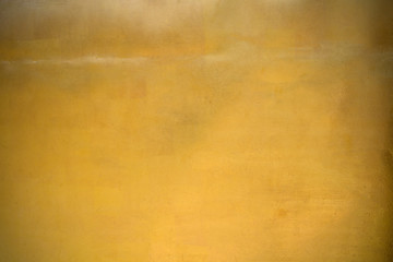 Shiny yellow leaf gold foil texture background