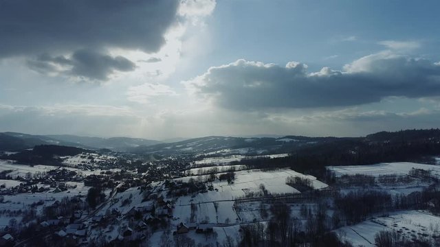 Typical Polish countryside in winter at sunset. Aerial, drone footage. 