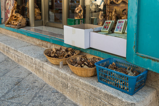 Wooden religious souvenirs are in boxes at the entrance to the gift shop in Bethlehem in Palestine