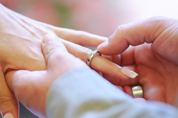 bride and groom Wedding ring exchange, straight marriage concept