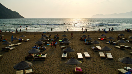 IZTUZU BEACH, MUGLA, TURKEY - AUGUST 25, 2019: Iztuzu beach and local and foreign tourists and those who want to see carettas show interest