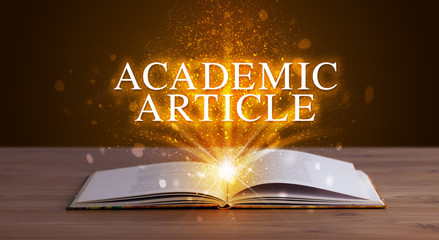 ACADEMIC ARTICLE inscription coming out from an open book, educational concept