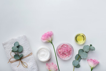 Fototapeta na wymiar Homemade rose extract cosmetics for spa and bath on white