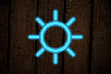 neon light with sun shape on dark background