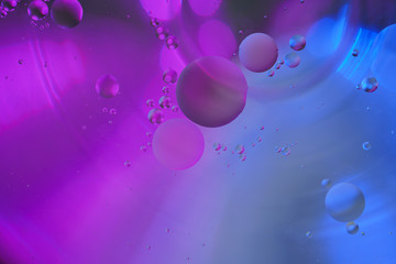 Abstract background with circles and balls. Bright purple and blue colors.