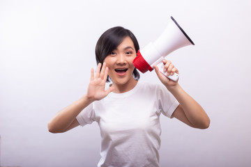 Happy woman with megaphone shouting