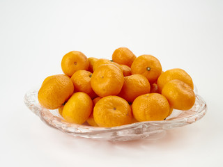 Tangerines or Mandarin orange fruit and peeled slices.On light background