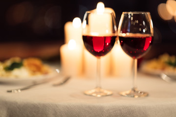 Two Glasses Of Red Wine Standing On Table In Restaurant