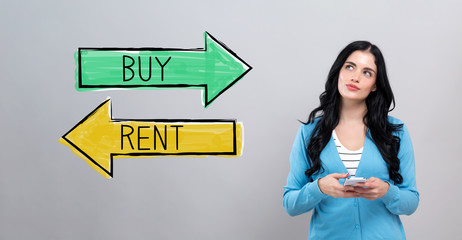 Buy or rent concept with thoughtful young woman holding a smartphone