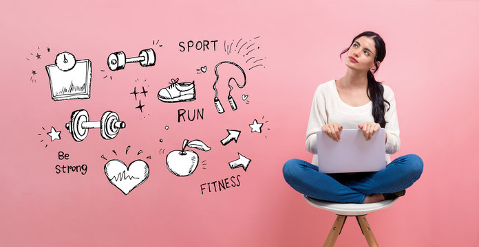 Fitness and diet with young woman using a laptop computer