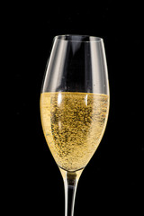 a golden ring in a glass with champagne, many bubbles, like a marriage proposal