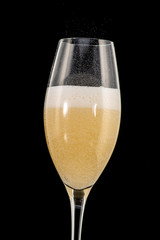 a golden ring in a glass with champagne, many bubbles, like a marriage proposal