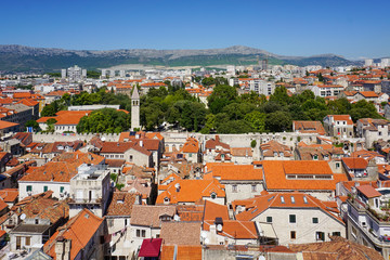 Fototapeta na wymiar View of the northwestern part of Split from the bell tower of the Split Palace. Old city, wall, in the distance is visible the bell tower and chapel of St. Arnir