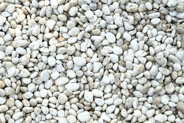 Background texture of stone wall. abstract background with dry round reeble stones.
