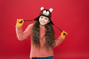 Cute accessories. Girl wear winter theme accessory. Fun and joy. Playful tiger. Festive spirit. Cheerful smiling kid. Playful cutie. Children seems cute. Adorable baby wear cute winter knitted hat