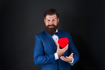 I believe in love. happy valentines day. tuxedo man red heart. love date. mature hipster beard in formal suit. problems with heart. businessman with bow tie. problems with heart. Romantic greeting