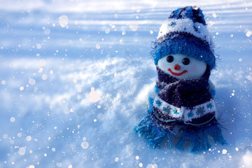 winter background with snowman and snow