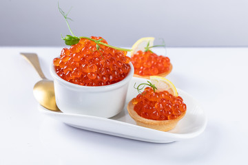 red caviar on a white plate. snack in canapes