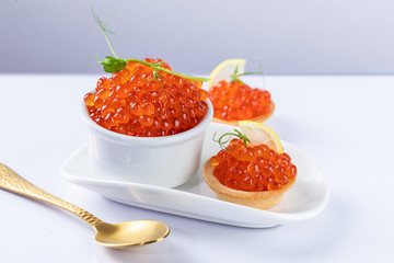 red caviar on a white plate. snack in canapes