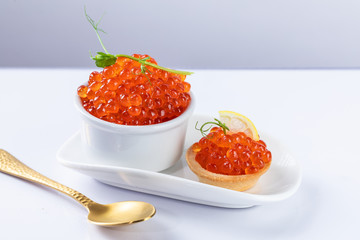 red caviar on a white plate. snack in canapes