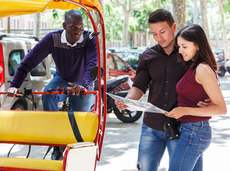 Couple wanting to hire rickshaw