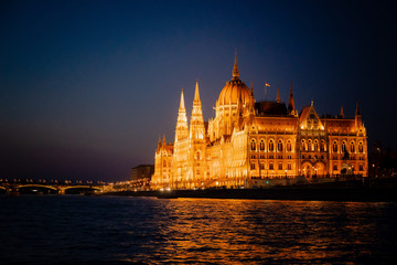 Obraz premium Budapest Hungary Parliament Building at Night from Danube River