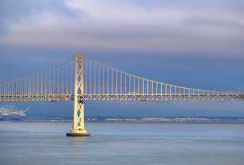 Obraz premium Light on Bay Bridge with Blue Cloudy Sky