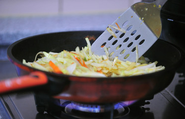 Fry potatoes in a frying pan