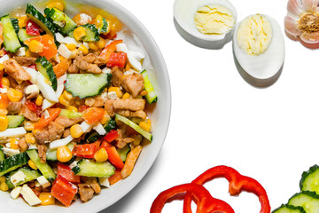 Bright vegetable salad in a white plate Isolated on a white background. Cooking a delicious dietary salad.