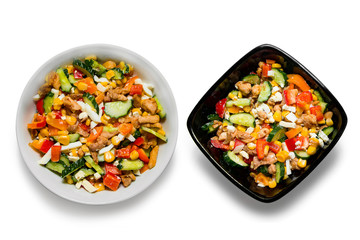 Bright vegetable salad in a white plate Isolated on a white background. Cooking a delicious dietary salad.