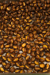 Background of roasted chestnuts. Traditional food.