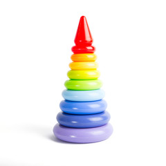Pyramid build from colorful plastic rings, isolated on white.
