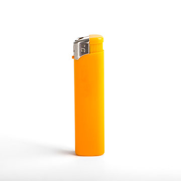 Yellow cigarette lighter isolated on a white