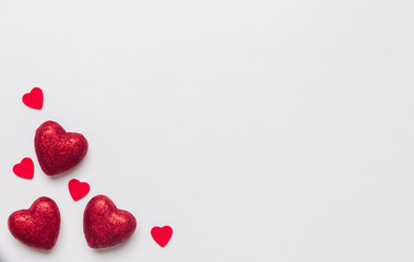 Stock photo of red hearts on a white background with a space for text